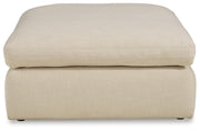 Ashley Furniture Elyza living room set with sofa and loveseat, featuring neutral upholstery and modern design.