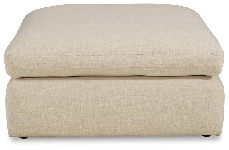 Ashley Furniture Elyza living room set with sofa and loveseat, featuring neutral upholstery and modern design.