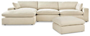 Ashley Furniture Elyza living room set with sofa and armchair in a modern design, featuring neutral fabric upholstery.