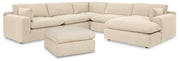 Ashley Furniture Elyza living room set includes a sofa and loveseat with neutral upholstery and stylish wooden legs.