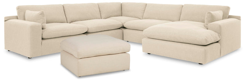 Ashley Furniture Elyza living room set includes a sofa and loveseat with neutral upholstery and stylish wooden legs.