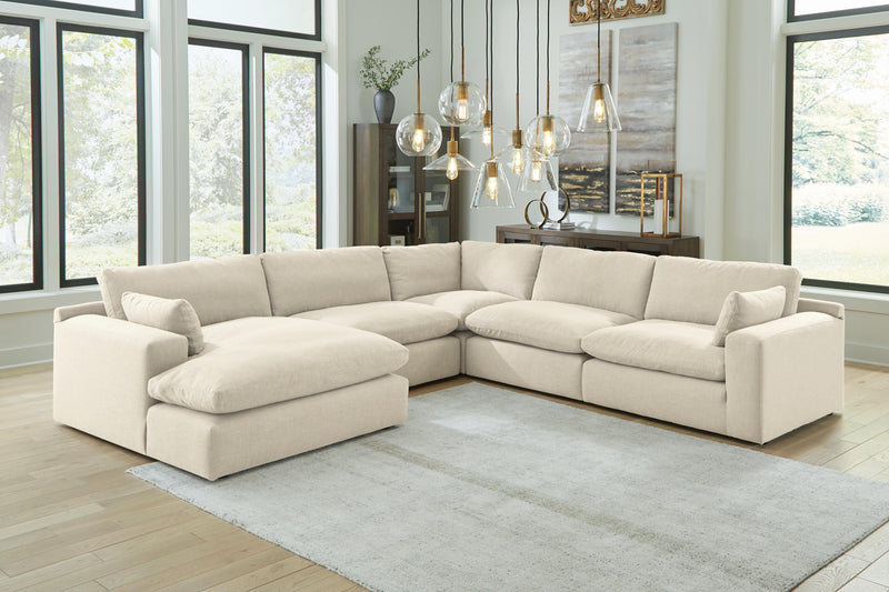 Ashley Furniture Elyza living room set with sofa and loveseat in a modern design, shown in a cozy living space.