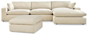 Ashley Furniture Elyza living room set with sofa, loveseat, and coffee table in a modern design, shown in a cozy living room setting.