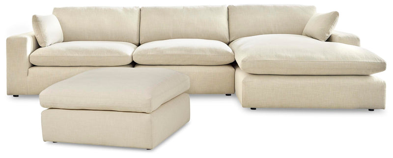 Ashley Furniture Elyza living room set with sofa, loveseat, and coffee table in a modern design, shown in a cozy living room setting.