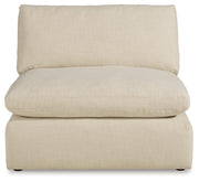Ashley Furniture Elyza living room set with plush sofa and matching armchair, featuring neutral upholstery and modern design.