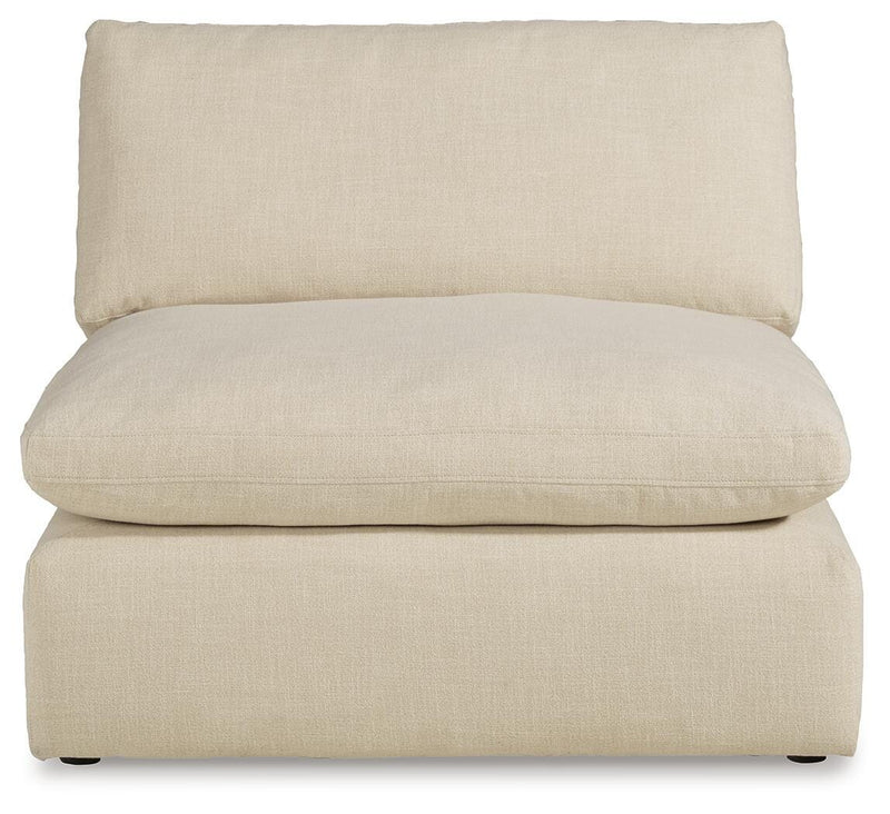 Ashley Furniture Elyza living room set with plush sofa and matching armchair, featuring neutral upholstery and modern design.