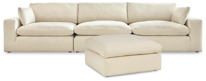 Ashley Furniture Elyza living room set featuring a sofa and armchair with neutral fabric upholstery and modern design.