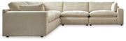 Ashley Furniture Elyza living room set with sofa and loveseat in a modern design, featuring plush cushions and neutral upholstery.