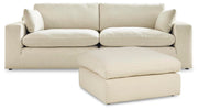 Ashley Furniture Elyza living room set featuring a sofa and loveseat with neutral upholstery and modern design.