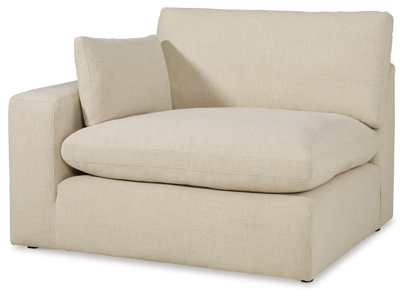 Ashley Furniture Elyza living room set featuring a sofa and loveseat with plush cushions and modern design, shown from an angled view.
