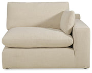 Ashley Furniture Elyza living room set featuring a sofa and armchair with plush cushions and neutral fabric upholstery.