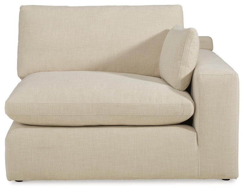 Ashley Furniture Elyza living room set featuring a sofa and armchair with plush cushions and neutral fabric upholstery.
