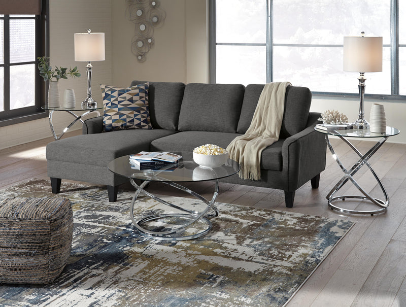 Set of three Ashley Furniture Hollynyx tables featuring sleek wooden surfaces and modern design, perfect for living room decor.