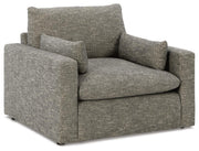 Ashley Furniture dramatic living room set with plush sofas and armchairs arranged in a modern style, showcased from an angled perspective.