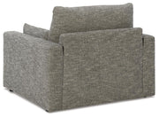 Oversized chair from Ashley Furniture with plush upholstery and dramatic design, shown from the back view.