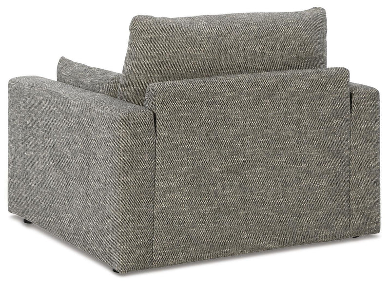 Oversized chair from Ashley Furniture with plush upholstery and dramatic design, shown from the back view.