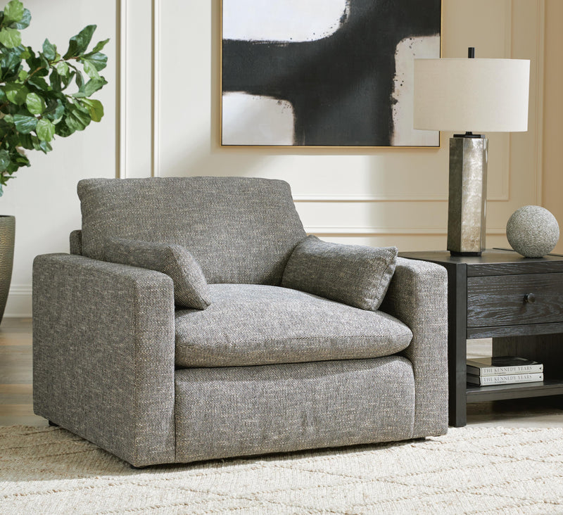 Large dramatic oversized chair by Ashley Furniture with plush fabric and modern design, perfect for a statement living room accent.