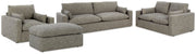 Ashley Furniture dramatic living room set featuring plush sofa and matching armchair with modern design and neutral fabric.