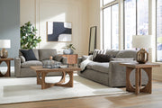 Ashley Furniture dramatic living room set featuring plush sofas with throw pillows, modern design and neutral upholstery.