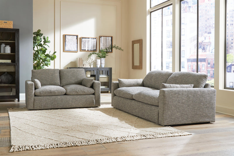Ashley Furniture dramatic living room set with plush sofa and armchair in a stylish, modern design.
