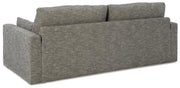 Ashley Furniture Dramatic Sofa with plush cushions and sleek design, shown from the back in a modern living room setting.