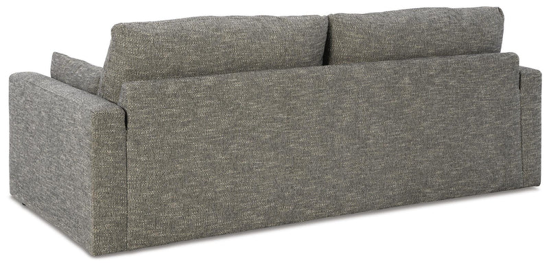 Ashley Furniture Dramatic Sofa with plush cushions and sleek design, shown from the back in a modern living room setting.