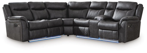 White Ashley Furniture Sultan Meadow reclining sectional with plush cushions and modern design, shown in a spacious living room setting.