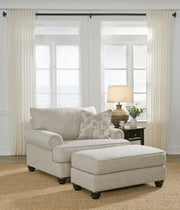 Ashley Furniture Asanti living room set with sofa, loveseat, and coffee table arranged in a modern, stylish living space.
