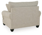 Ashley Furniture Asanti living room set with a sofa and loveseat, featuring plush cushions and classic design.