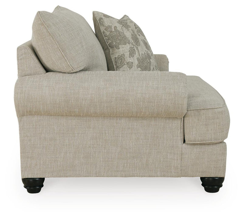 Ashley Furniture Asanti Living Room Set with sofa and armchair in a modern design, shown with neutral upholstery and wooden legs.