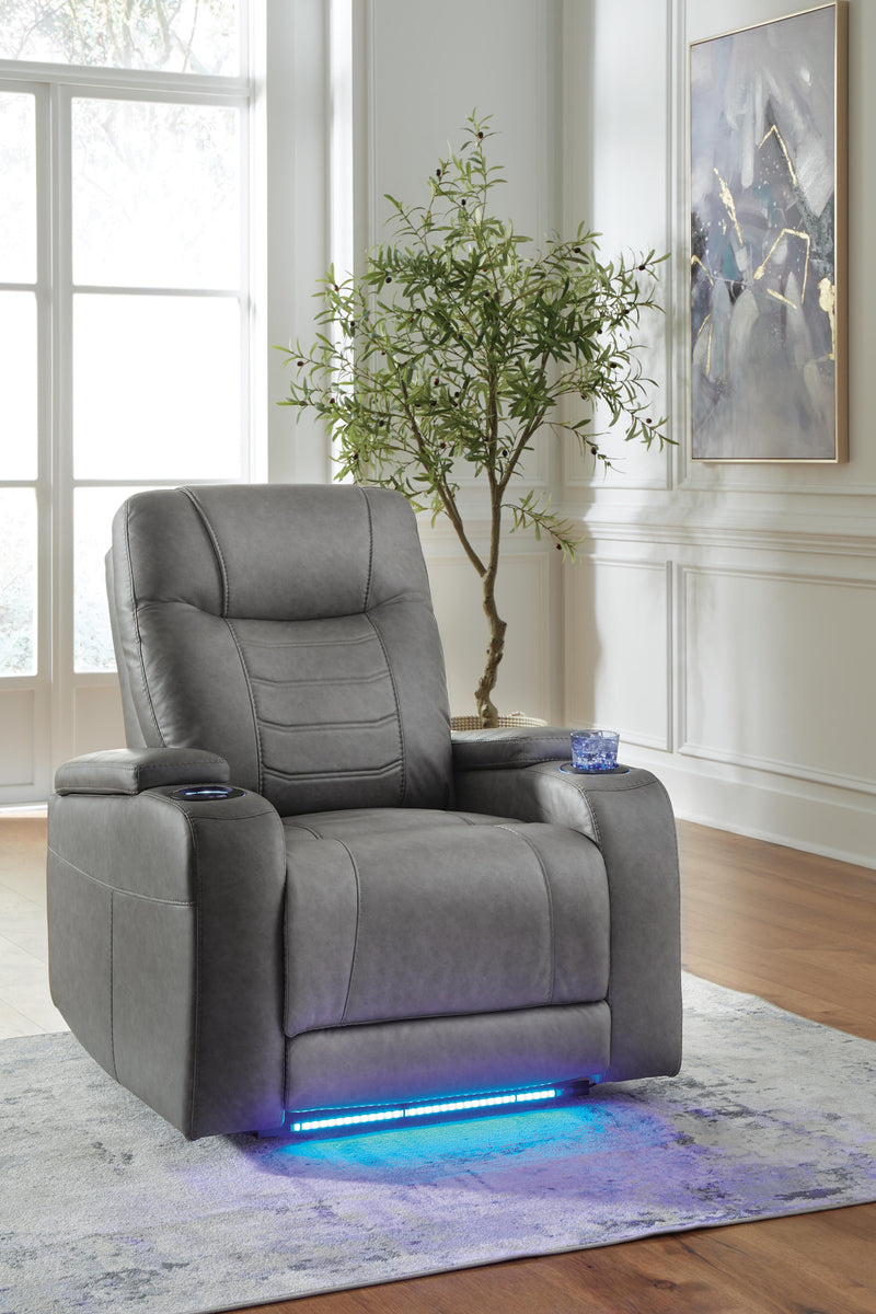 Ashley Furniture Schooner Rocks Power Recliner in closed position, featuring plush upholstery and built-in recline mechanism.
