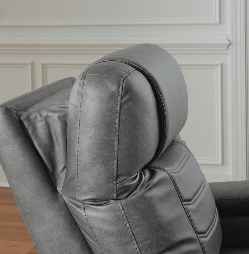 Ashley Furniture Schooner Rocks Power Recliner showing plush upholstery and reclining mechanism in a modern living room setting