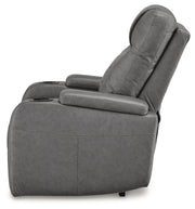 Ashley Furniture Schooner Rocks Power Recliner shown from the side, featuring plush upholstery and ergonomic design.
