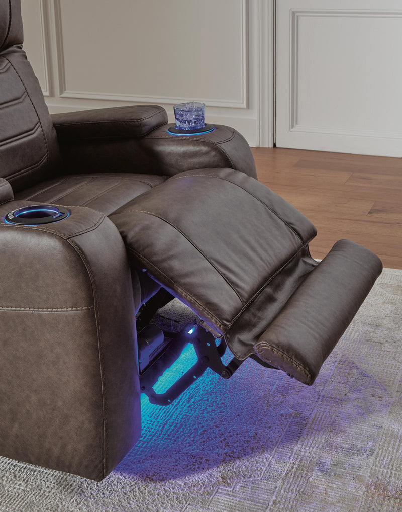 Ashley Furniture Schooner Rocks Power Recliner with plush upholstery and modern design, shown in a relaxed reclined position.