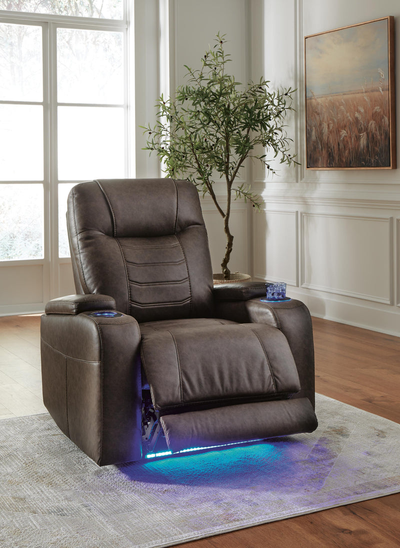 Open Ashley Furniture Schooner Rocks Power Recliner showing plush fabric and reclining mechanism in a modern living room setting.
