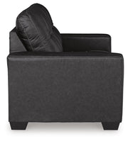 Ashley Furniture Barlin Mills loveseat with plush fabric and cushioned armrests, shown in a cozy living room setting.
