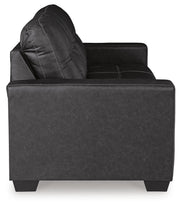 Ashley Furniture Barlin Mills sofa sleeper with beige fabric, showing the side view and convertible sleeper mechanism.