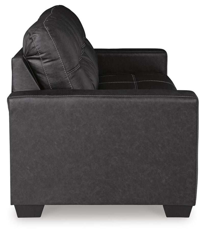 Ashley Furniture Barlin Mills sofa sleeper with beige fabric, showing the side view and convertible sleeper mechanism.