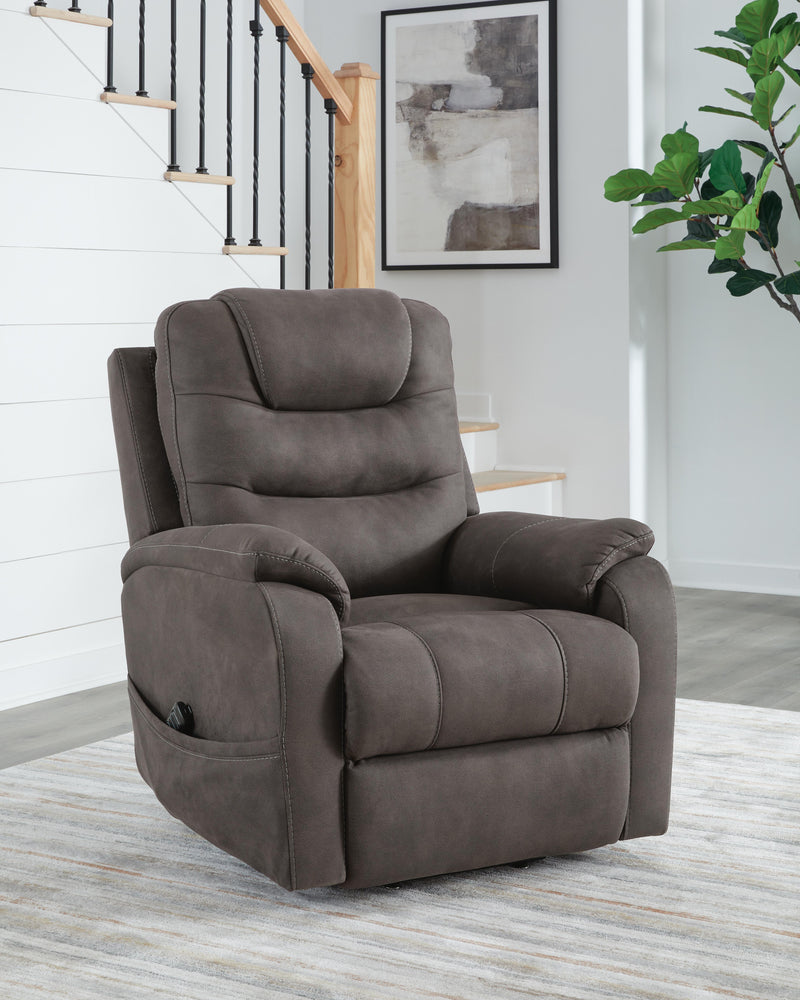 Ashley Furniture Snowfield Power Lift Recliner in closed position, featuring plush upholstery and a sturdy wooden base.