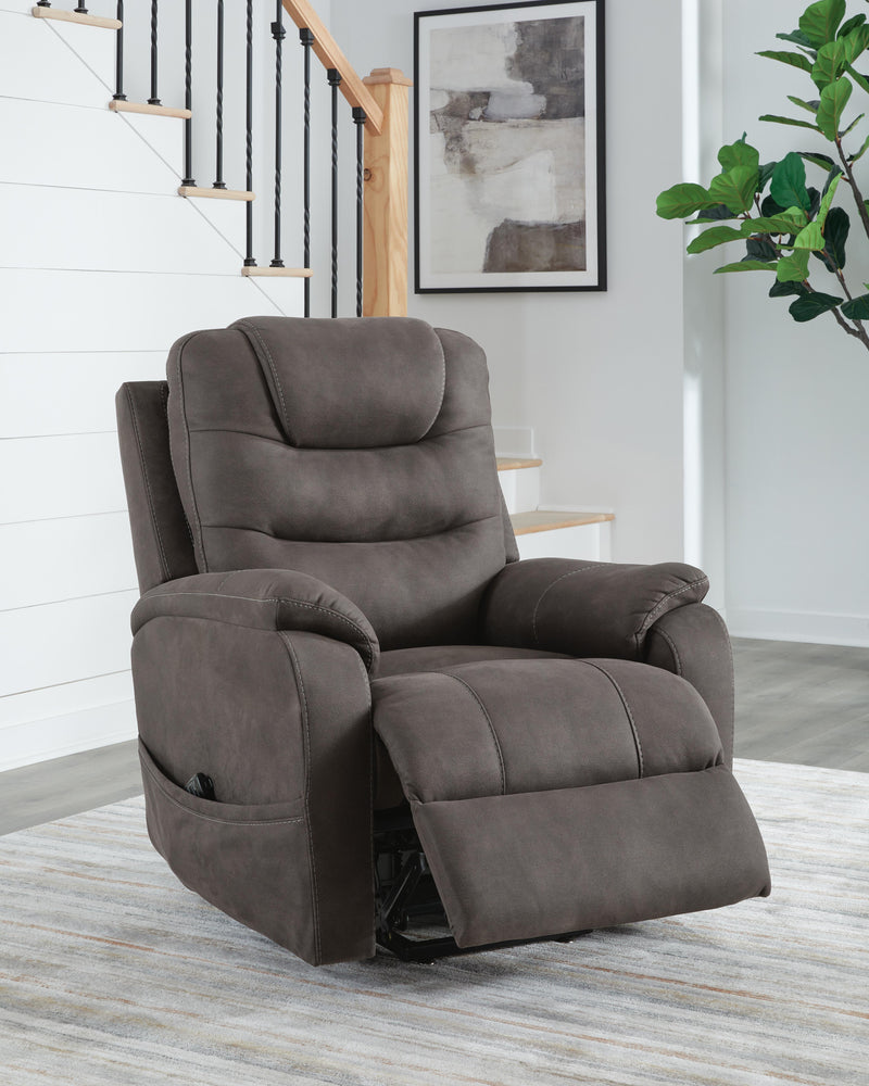 Ashley Furniture Snowfield Power Lift Recliner in a reclined position with plush upholstery and smooth lifting mechanism.