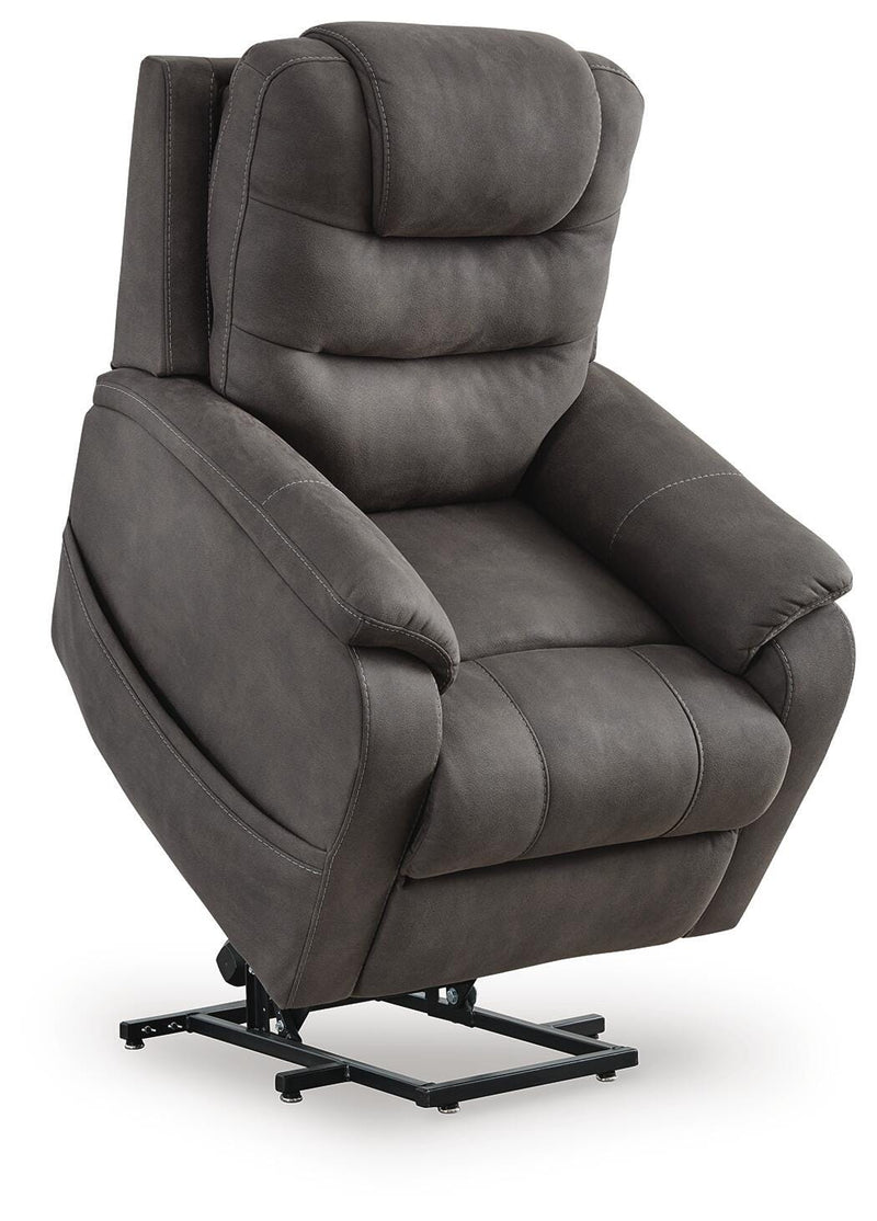 Ashley Furniture Snowfield Power Lift Recliner in beige fabric, showing the reclined position with plush cushioning and supportive backrest.