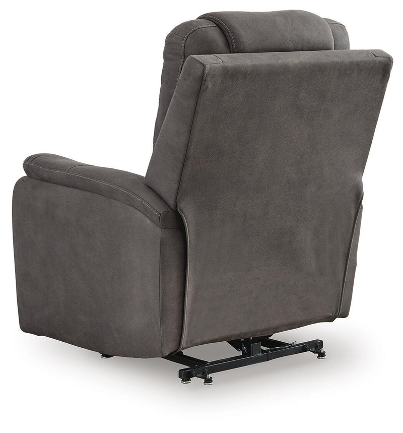 Ashley Furniture Snowfield Power Lift Recliner showing plush fabric, padded armrests, and adjustable back for comfort.
