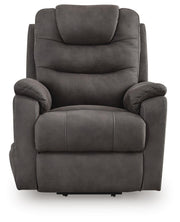 Ashley Furniture Snowfield Power Lift Recliner with plush fabric, padded armrests, and a built-in power lift mechanism.