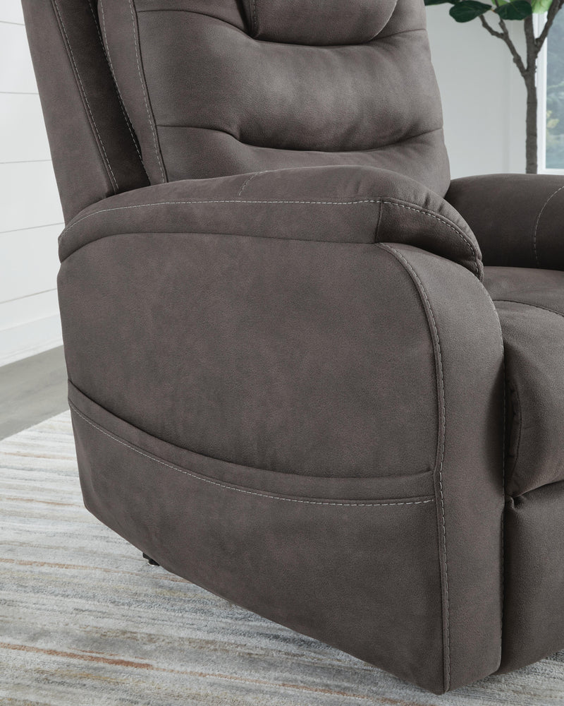 Ashley Furniture Snowfield Power Lift Recliner with plush upholstery and pocketed coil cushioning, shown in a close-up detail shot.