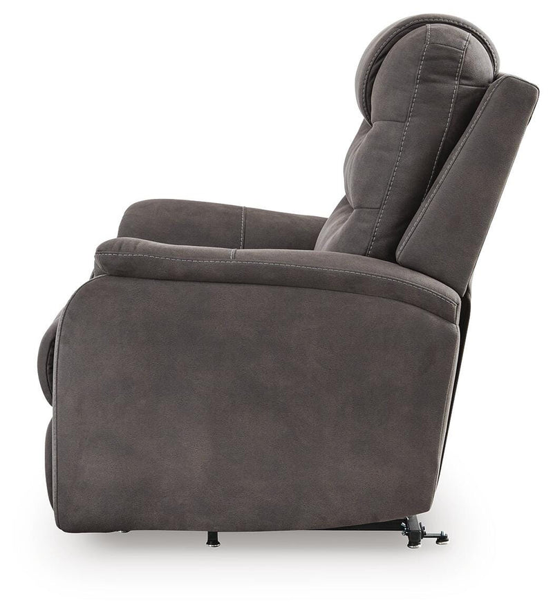 Ashley Furniture Snowfield Power Lift Recliner in gray fabric, showing side view with padded armrests and plush seating.