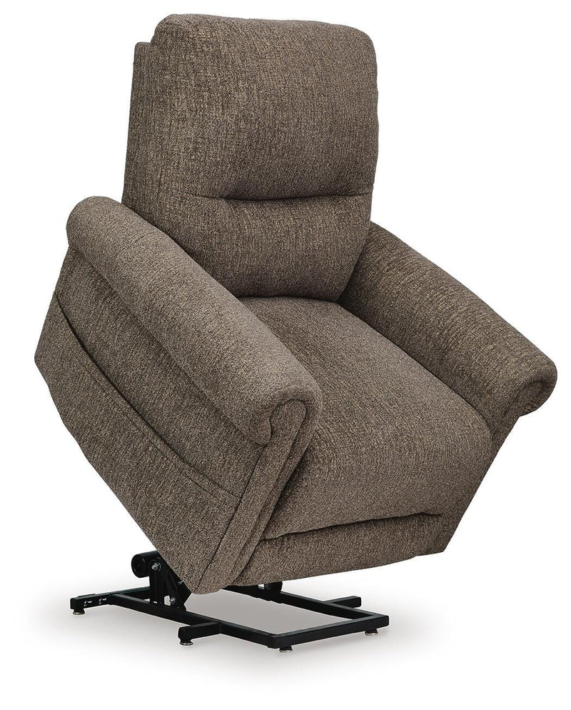Ashley Furniture Aureta Power Lift Recliner showing a side view with a plush, padded design in a neutral fabric.