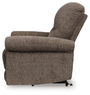Ashley Furniture Aureta Power Lift Recliner in beige fabric, showing the side view with padded armrests and plush cushioning.