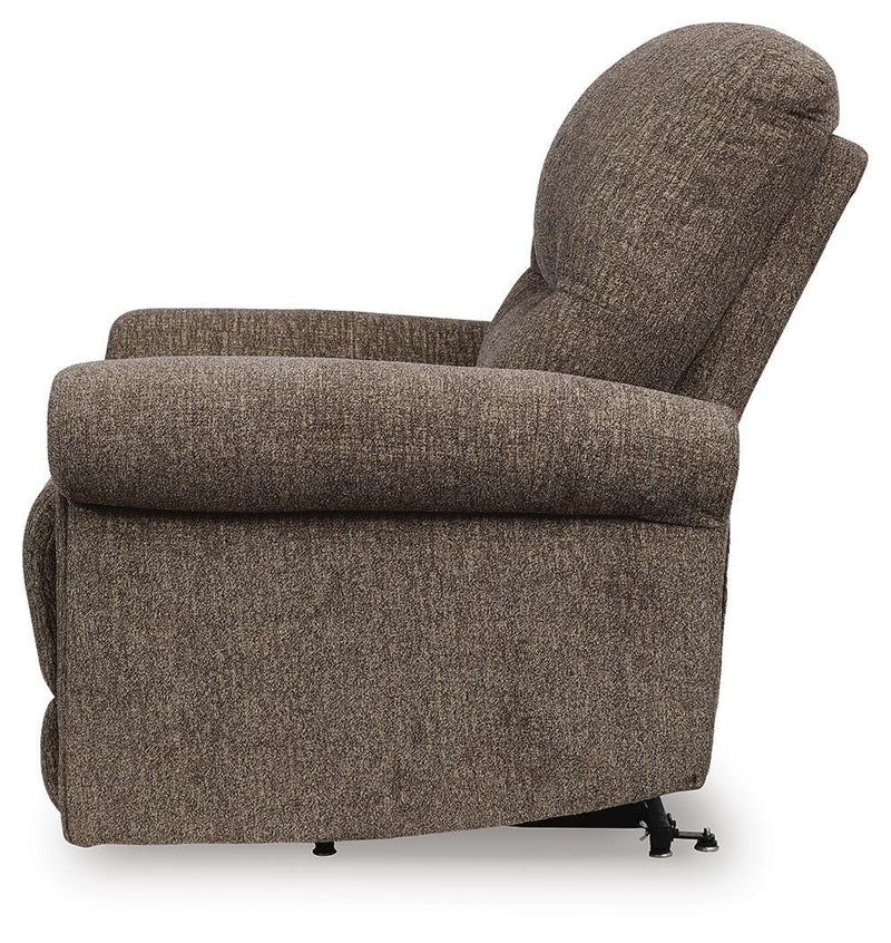 Ashley Furniture Aureta Power Lift Recliner in beige fabric, showing the side view with padded armrests and plush cushioning.