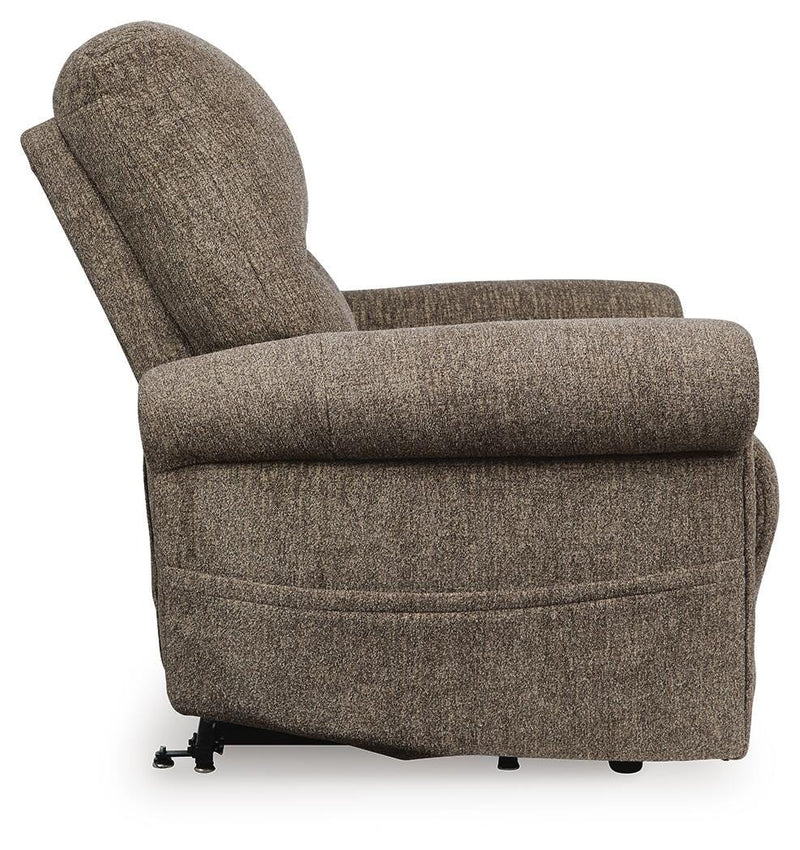 Ashley Furniture Aureta Power Lift Recliner in beige with plush upholstery and side control panel for easy adjustment.