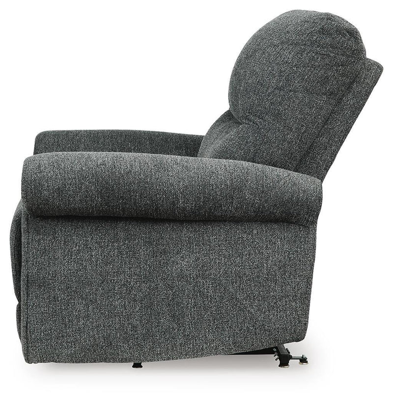 Ashley Furniture Aureta Power Lift Recliner shown from side view, featuring plush upholstery and a sturdy recline mechanism.